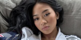 Suni Lee wearing Team USA jacket and Olympic rings necklace LA 2028 Olympics comeback