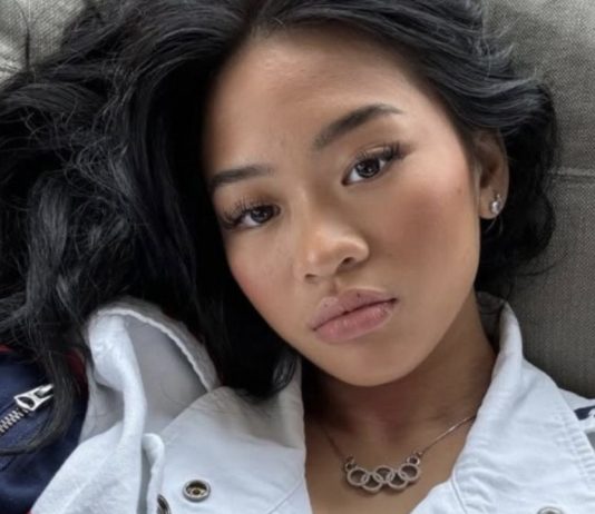 Suni Lee wearing Team USA jacket and Olympic rings necklace LA 2028 Olympics comeback